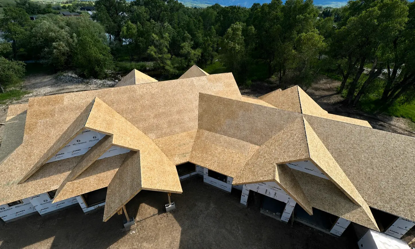Aerial view of a complex custom roof under construction